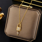 Necklace with key and padlock pendant in gold