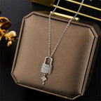 Necklace with key and padlock pendant in silver