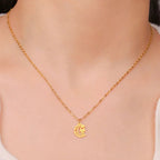 Necklace with Arabic Islamic crescent moon and Hamsa pendant in gold