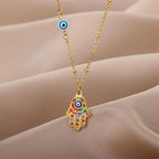 Necklace with multicolor Arabic evil eye and Hamsa protection pendant in gold