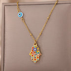 Necklace with multicolor Arabic evil eye and Hamsa protection pendant in gold