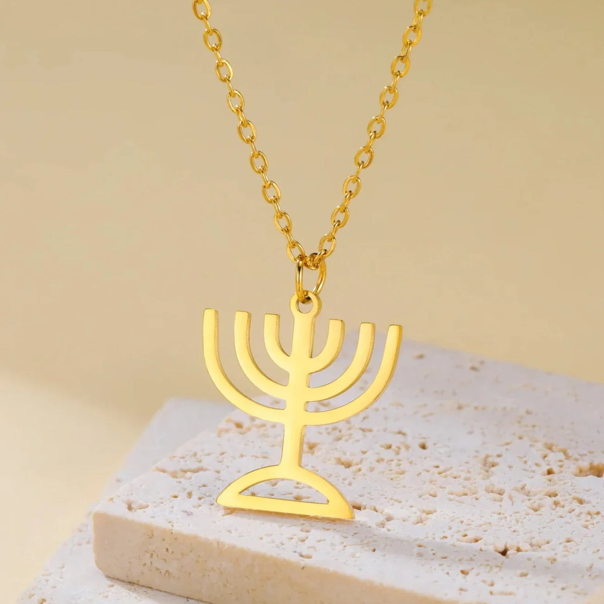 Necklace with pendant featuring the Jewish identity symbol Menorah gold