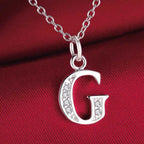 Long necklace with initial pendant g