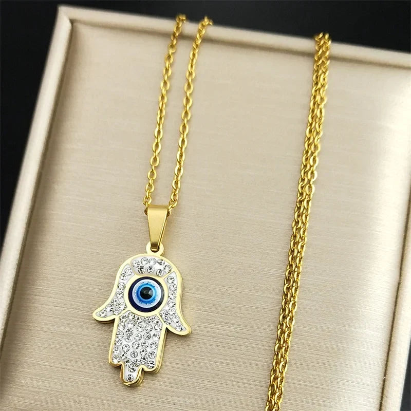 Long necklace with evil eye protection pendant and Arabic Hamsa hand in gold