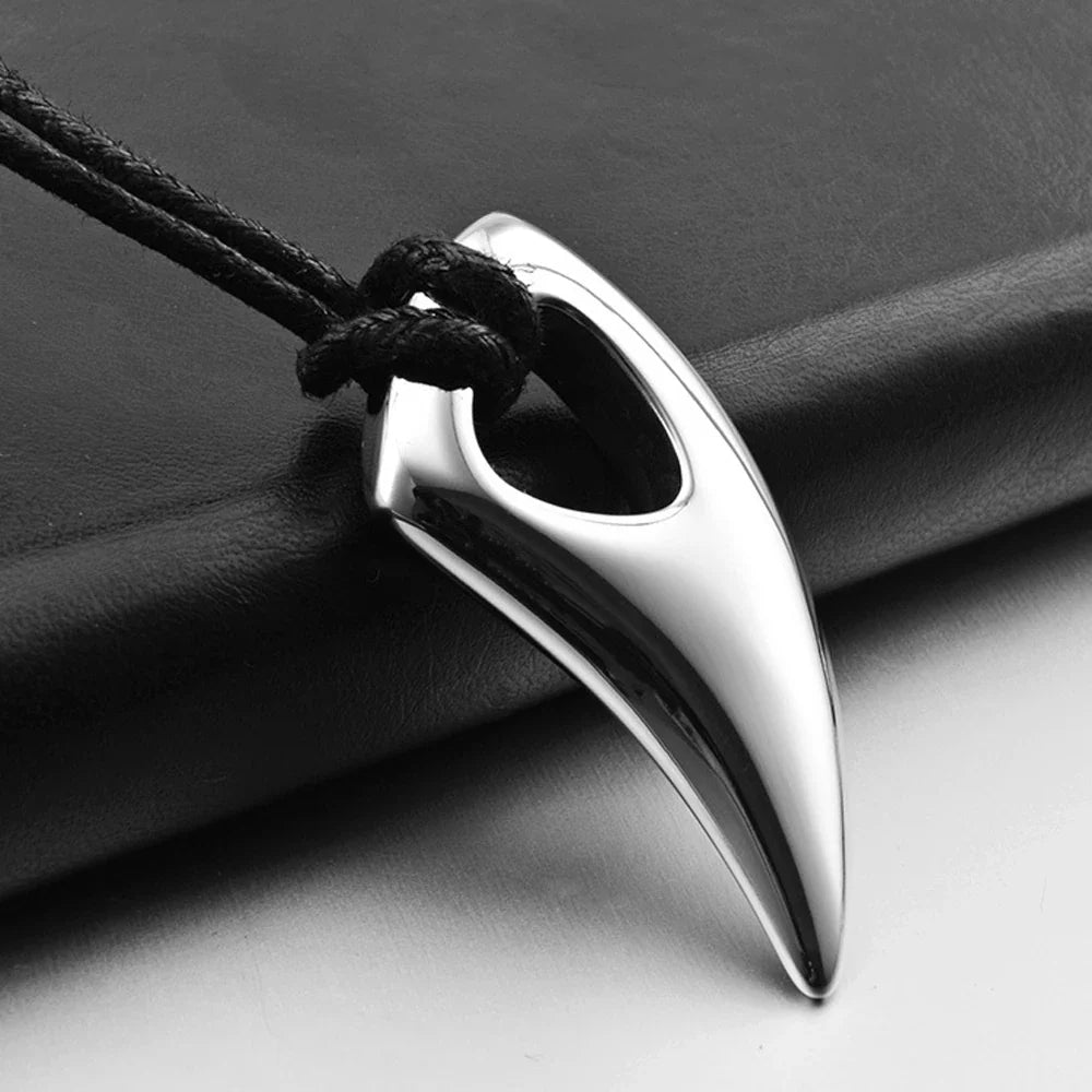 Cord necklace with silver shark tooth pendant