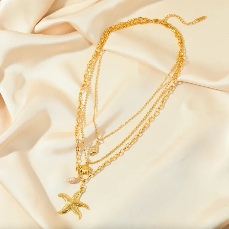 Multi-Strand Necklace with Shell Pendant, Starfish, Conch, and Scallop Shell