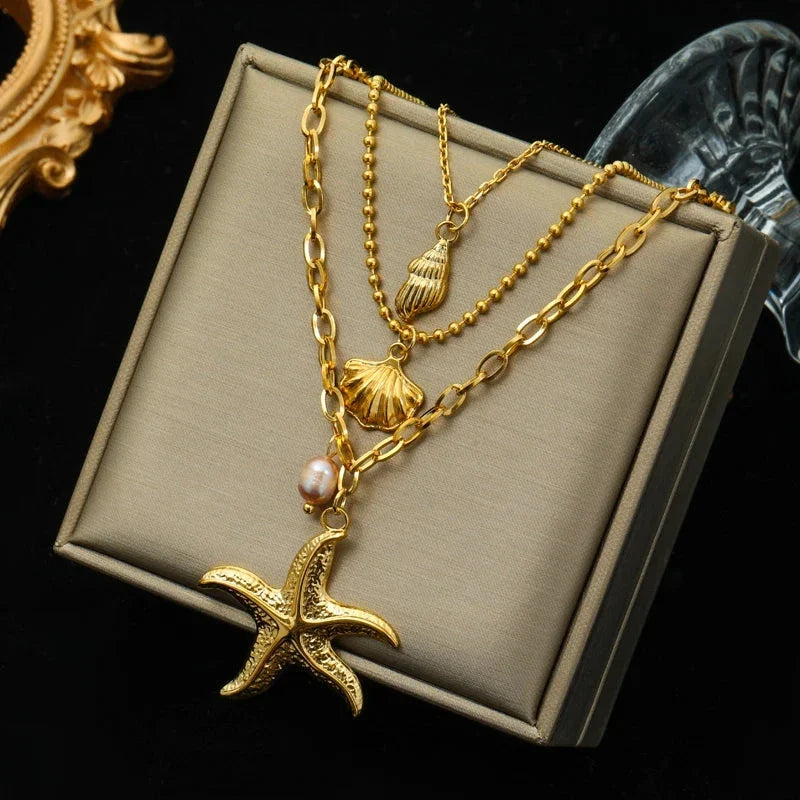 Multi-Strand Necklace with Shell Pendant, Starfish, Conch, and Scallop Shell