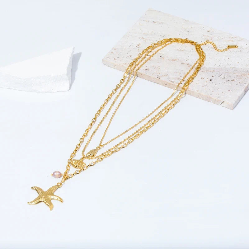 Multi-Strand Necklace with Shell Pendant, Starfish, Conch, and Scallop Shell