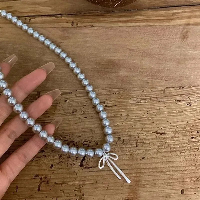 Necklace with Gray Bead Pendant and Bow Knot 