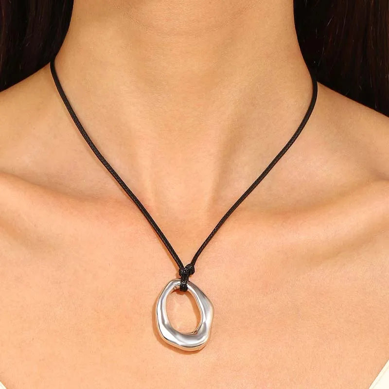 Hollow Water Drop Pendant Necklace Black Cord and Silver