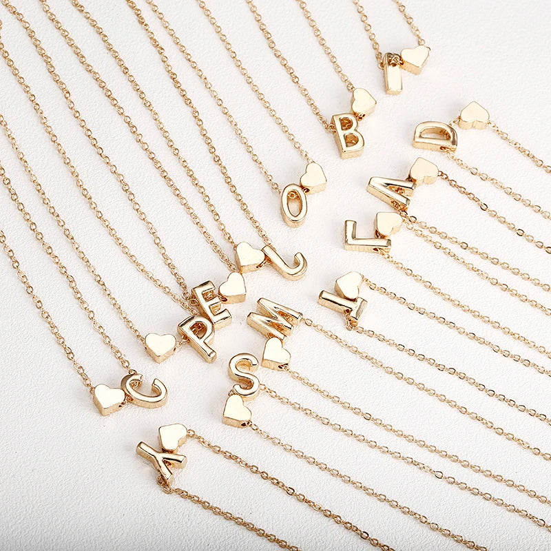 Women's necklace with initial and heart pendant