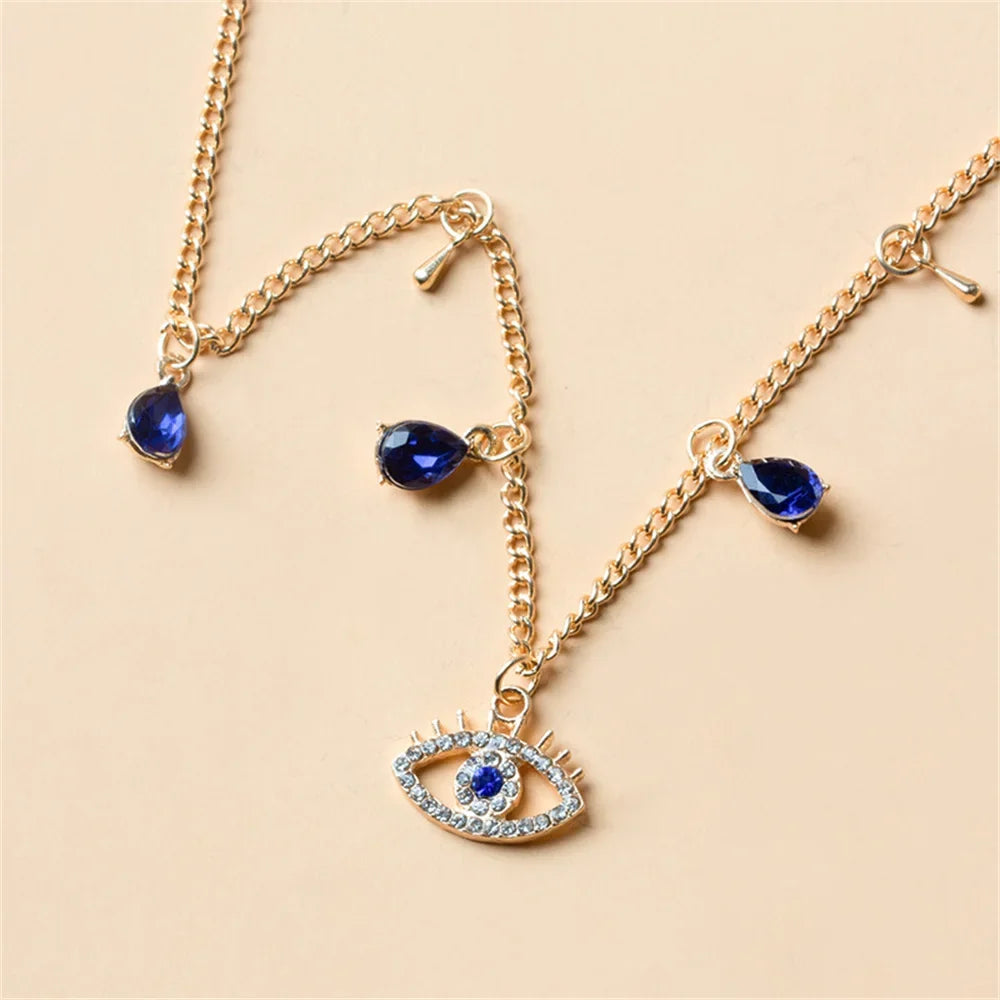 Choker Necklace with Blue Turkish Evil Eye Pendant, Rhinestones and Pearls in gold
