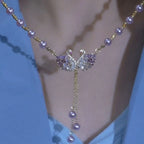 Purple necklace with two swans in the shape of a heart