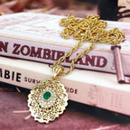 Long necklace with traditional Arabic green gold-tone pendant