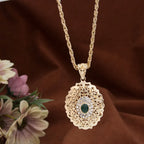 Long necklace with traditional Arabic green gold-tone pendant