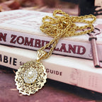 Long necklace with traditional Arabic white gold-tone pendant