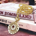 Long necklace with traditional Arabic red gold-tone pendant