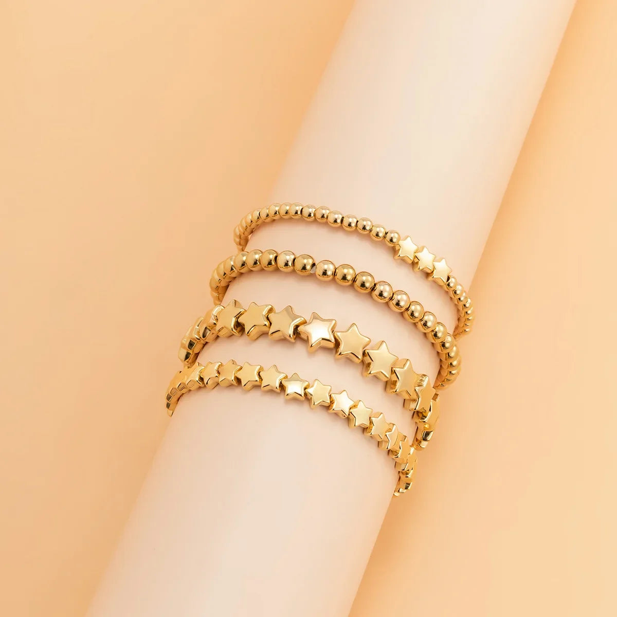 Set of 4 Star Bracelets in gold