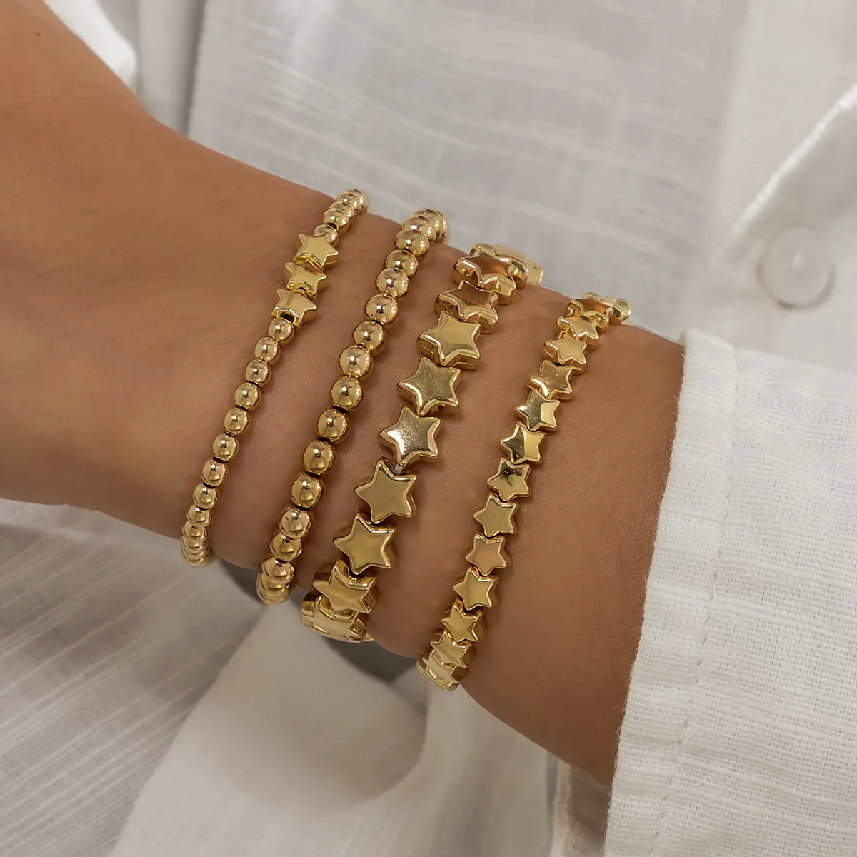 Set of 4 Star Bracelets in gold